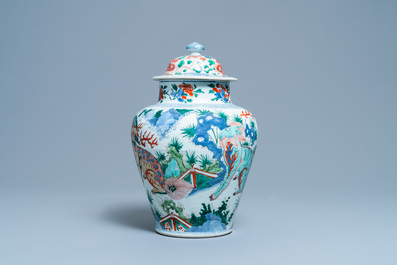 A Chinese wucai 'mythical beasts' vase and cover, Transitional period