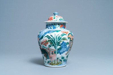 A Chinese wucai 'mythical beasts' vase and cover, Transitional period