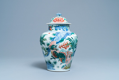 A Chinese wucai 'mythical beasts' vase and cover, Transitional period