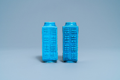 A pair of Chinese monochrome turquoise 'cong' vases with trigrams, 19th C.