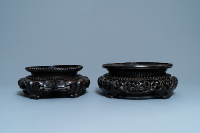 Two large Chinese reticulated wooden stands, 18/19th C.