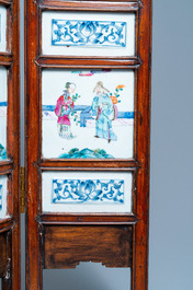 A Chinese wooden four-fold screen with famille rose plaques, 19th C.