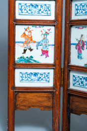 A Chinese wooden four-fold screen with famille rose plaques, 19th C.