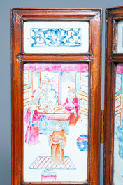 A Chinese wooden four-fold screen with famille rose plaques, 19th C.
