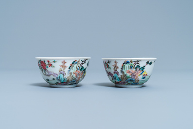 A pair of Chinese famille rose cups and saucers with landscape design, Yongzheng