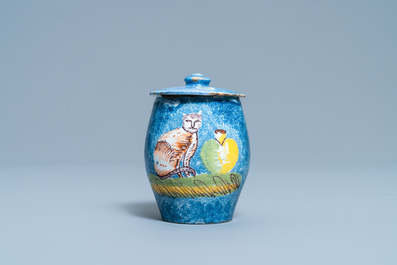 A polychrome Brussels faience mustard jar and cover with a cat, 18th C.