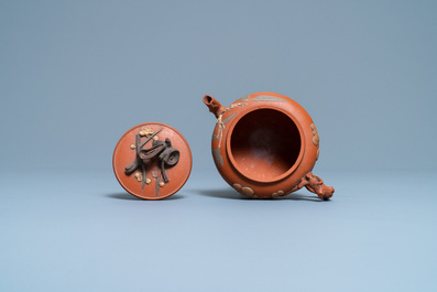 A Chinese Yixing stoneware 'Three friends of winter' teapot and cover, Kangxi