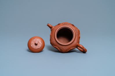 A Chinese Yixing stoneware lotus-shaped teapot and cover, Kangxi