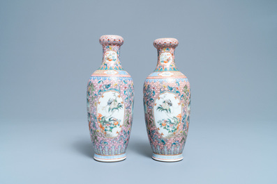 A pair of Chinese famille rose vases with tigers, Qianlong mark, 20th C.