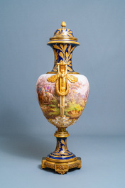 Une paire de tr&egrave;s grands vases en porcelaine dans le style de S&egrave;vres aux montures en bronze dor&eacute;, sign&eacute;s Desprez, France, 19&egrave;me