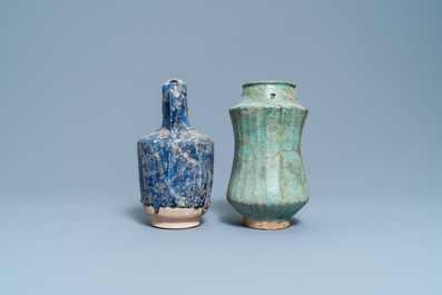 A turquoise-glazed Islamic pottery albarello and a blue-glazed ewer, Iran or Syria, 12/13th C.