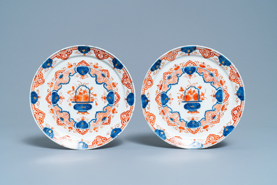A Dutch Delft dor&eacute; 'flower basket' charger and a pair of plates, early 18th C.