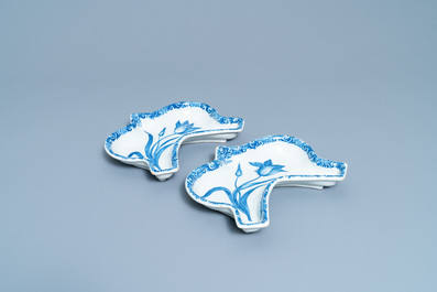 A pair of Dutch Delft blue and white carnation flower dishes, 18th C