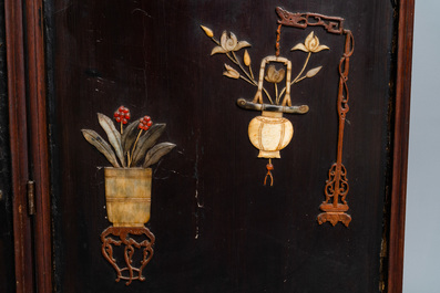 A Chinese lacquered wooden screen embellished with bone, wood and various stones, 18/19th C.