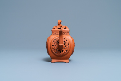 A Chinese reticulated Yixing stoneware teapot and cover, Kangxi