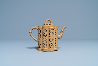 A Chinese reticulated Yixing stoneware teapot and cover, Kangxi