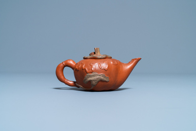 A Chinese relief-decorated Yixing stoneware teapot and cover, 18/19th C.