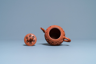 A Chinese reticulated Yixing stoneware teapot and cover, Kangxi