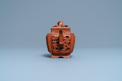 A Chinese reticulated Yixing stoneware teapot and cover, Kangxi