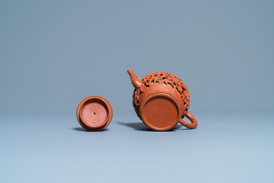 A Chinese reticulated Yixing stoneware teapot and cover, Kangxi