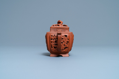 A Chinese reticulated Yixing stoneware teapot and cover, Kangxi