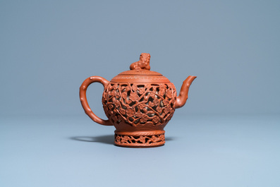 A Chinese reticulated Yixing stoneware teapot and cover, Kangxi