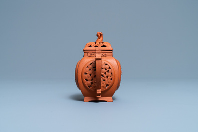 A Chinese reticulated Yixing stoneware teapot and cover, Kangxi