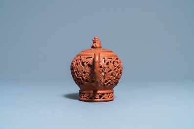 A Chinese reticulated Yixing stoneware teapot and cover, Kangxi