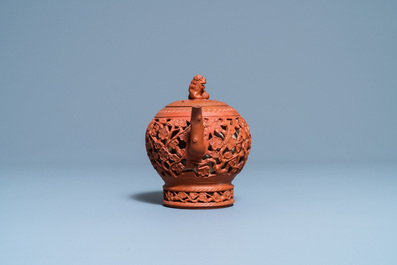 A Chinese reticulated Yixing stoneware teapot and cover, Kangxi