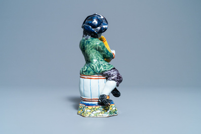 A polychrome Dutch Delft figure of a bagpipe player, 18th C.