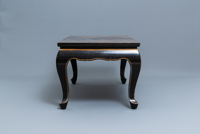 A Chinese rectangular lacquered wood table for the European market, 19th C.