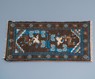 Two Chinese rectangular woollen carpets, 19/20th C.