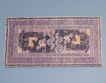 Two Chinese rectangular woollen carpets, 19/20th C.