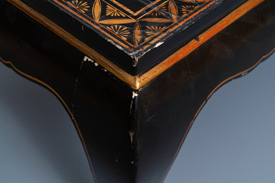 A Chinese rectangular lacquered wood table for the European market, 19th C.