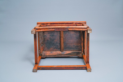 A Chinese wooden chair with inserted carved panels, 19th C.
