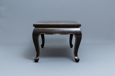 A Chinese rectangular lacquered wood table for the European market, 19th C.