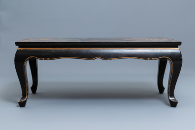 A Chinese rectangular lacquered wood table for the European market, 19th C.