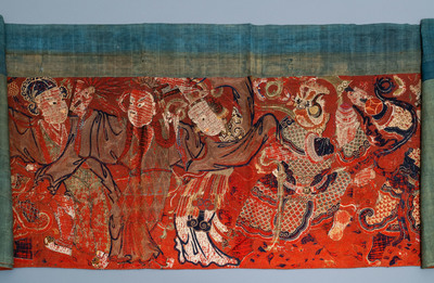 A large Chinese horizontal embroidered red-ground textile panel, 19th C.
