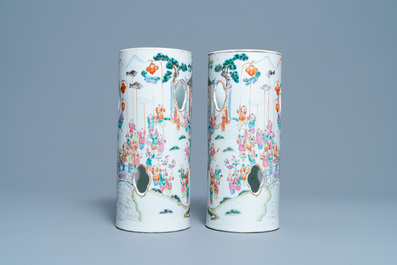A pair of reticulated Chinese famille rose '100 boys' hat stands, Qianlong mark, 19th C.