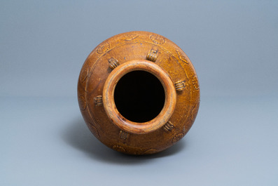 A large Chinese brown-glazed relief-molded and incised martaban jar, Qing