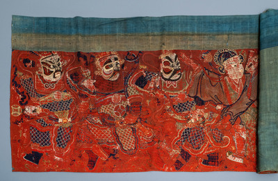 A large Chinese horizontal embroidered red-ground textile panel, 19th C.