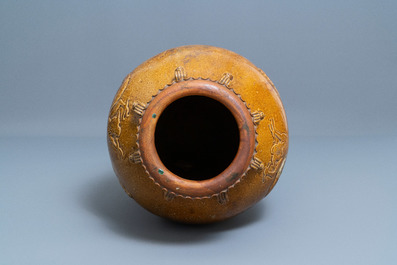 A large Chinese brown-glazed relief-molded martaban jar with dragons, Qing