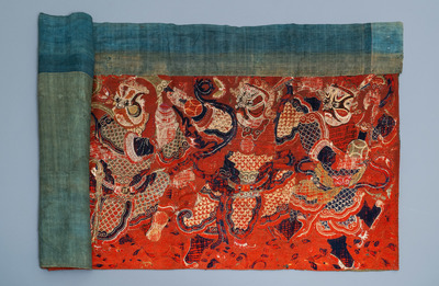 A large Chinese horizontal embroidered red-ground textile panel, 19th C.