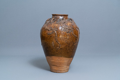 A large Chinese brown-glazed relief-molded martaban jar with dragons, Qing