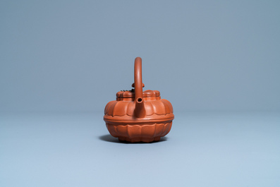 A Chinese Yixing stoneware chrysanthemum-shaped teapot and cover, Yongzheng/Qianlong