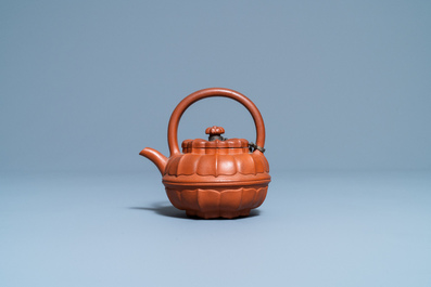 A Chinese Yixing stoneware chrysanthemum-shaped teapot and cover, Yongzheng/Qianlong