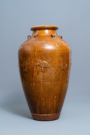 A large Chinese brown-glazed relief-molded and incised martaban jar, Qing