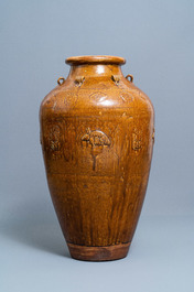 A large Chinese brown-glazed relief-molded and incised martaban jar, Qing