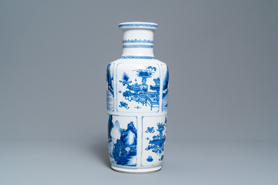 A Chinese blue and white 'antiquities and landscapes' rouleau vase, Kangxi