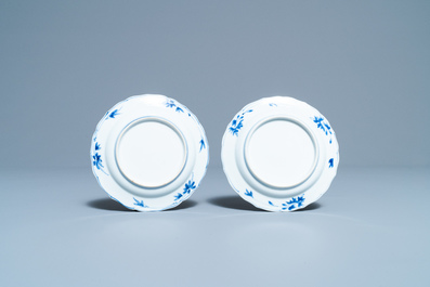 A pair of Chinese blue and white plates with boys riding horses, Kangxi